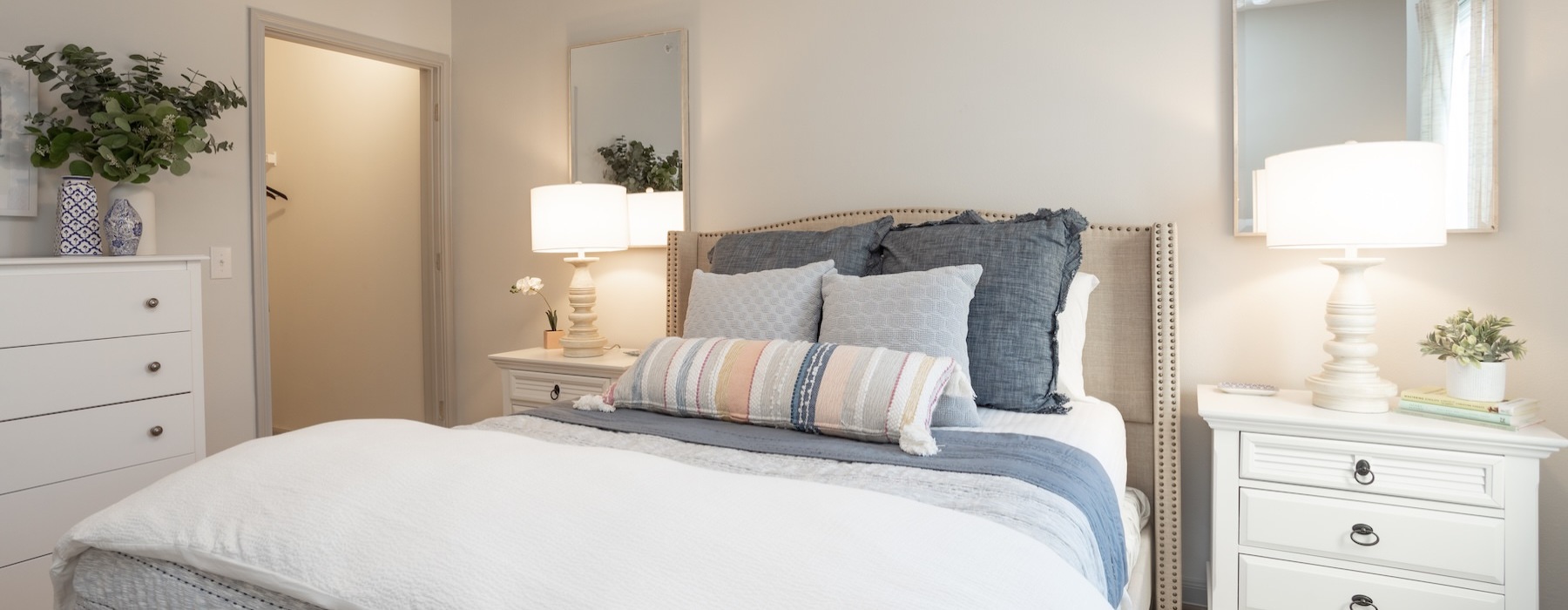 a bedroom with a bed and two nightstands