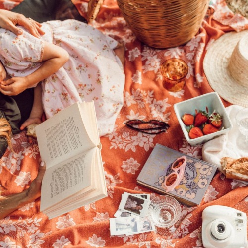 a mother and daughter having a picnic